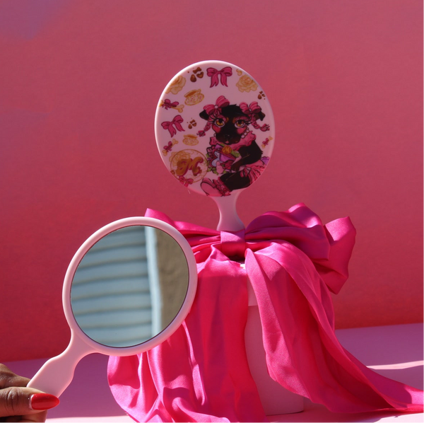 Hand held coquette mirror